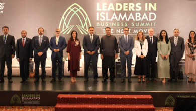 LIIBS 2026, group photograph of business leaders and speakers standing on stage at the Leaders in Islamabad Business Summit 2026, with the event backdrop displaying the theme “The Next Move.