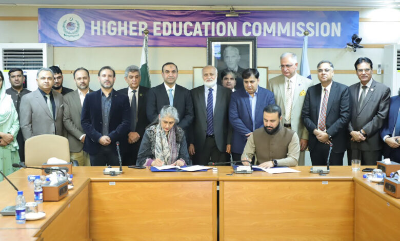 Representatives from HEC Pakistan and National CERT signing an MoU at a conference table, surrounded by senior officials under a Higher Education Commission banner.